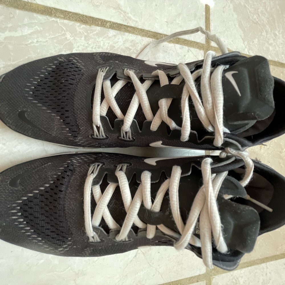 Nike “Free Run” black and white women’s size 8 running shoe.